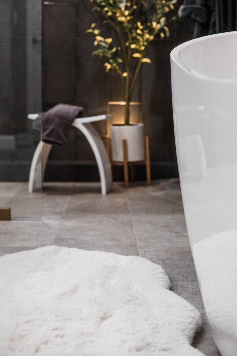 Heated tile flooring in a luxury primary bathroom remodel, with radiant in-floor warmth running beneath the patterned tile.