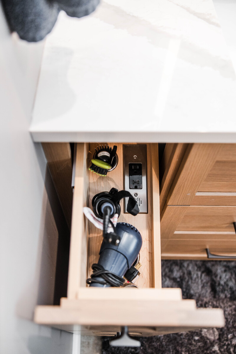 Custom drawer for hair tools and integrated outlet