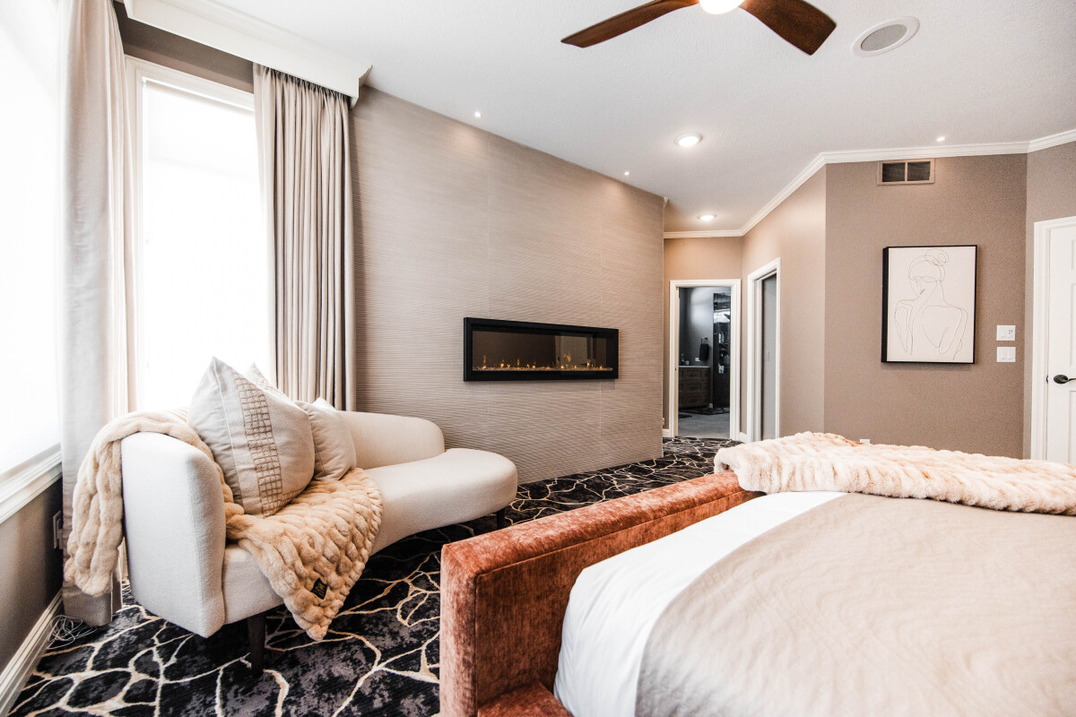 Luxury Primary Suite with fireplace wall designed by Discrete Designs 