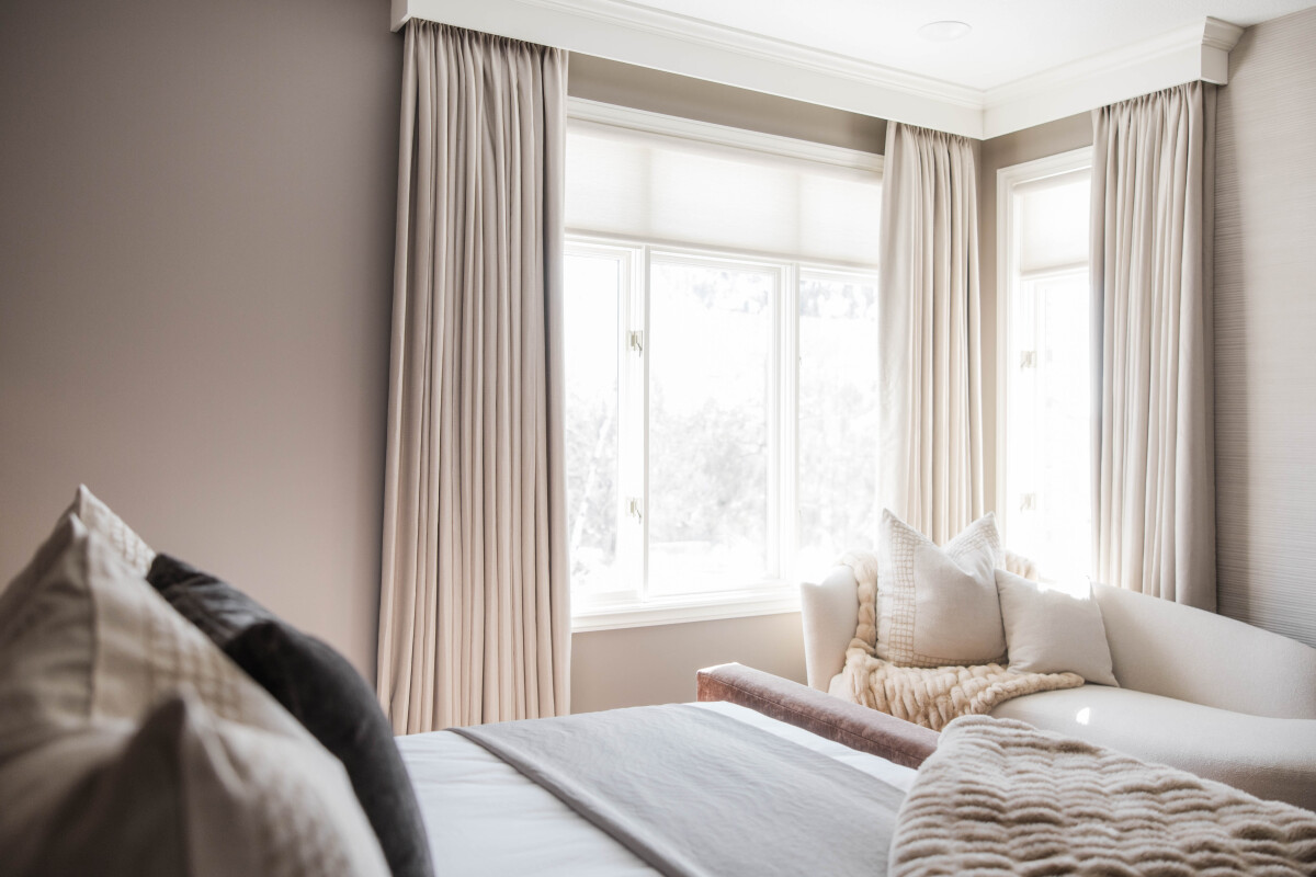 Custom Drapery Panels and motorized roller shades on a timer